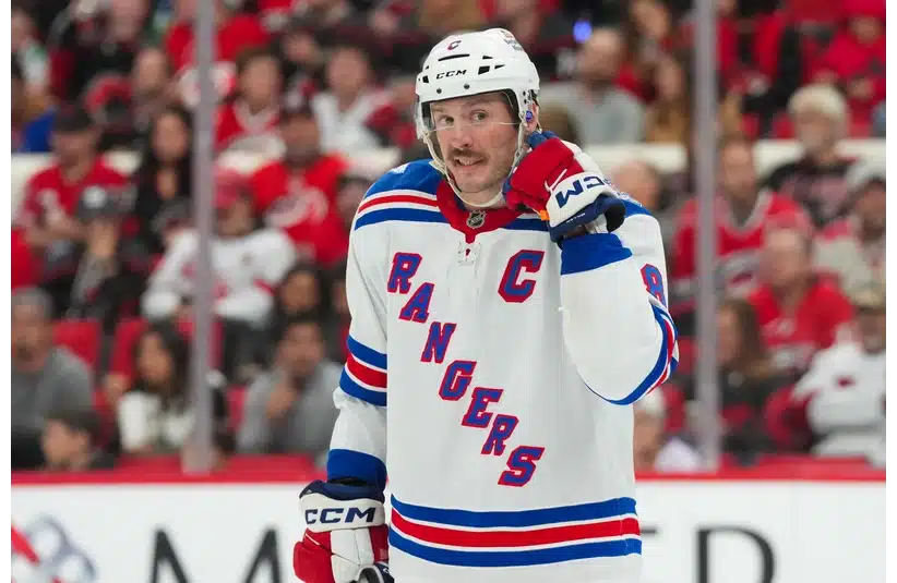 J.T. Miller reacts against the Hurricanes