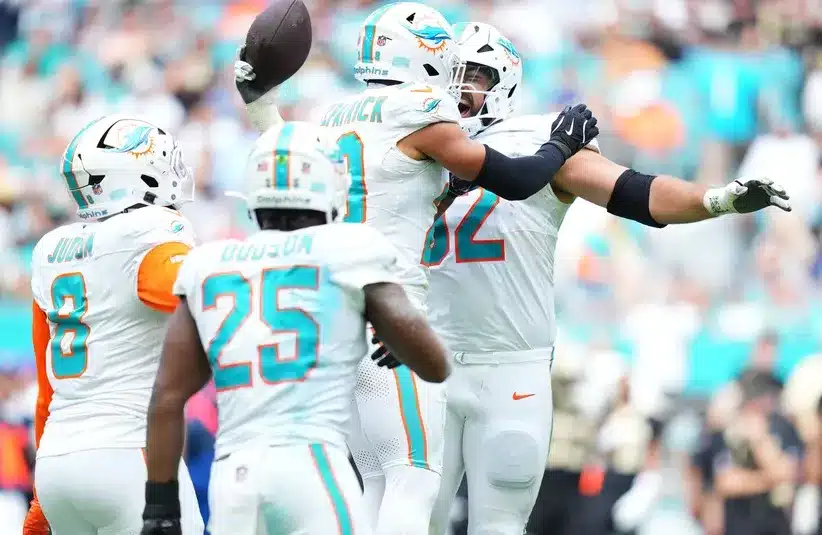 Miami Dolphins defensive tackle Zach Sieler (92) reacts with safety Minkah Fitzpatrick (29) after forcing a fumble
