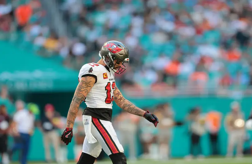 Mike Evans (13) walks on the field during the fourth quarter vs. Miami Dolphins at Hard Rock Stadium.