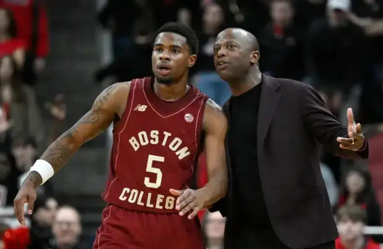 Boston College Eagles head coach Earl Grant talks with Fred Payne