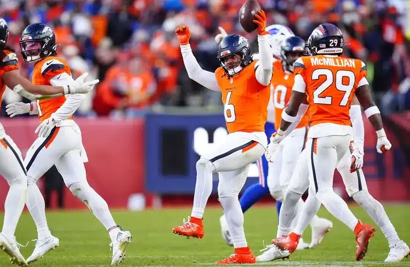 Denver Broncos safety P.J. Locke (6) celebrates with teammates after intercepting a pass