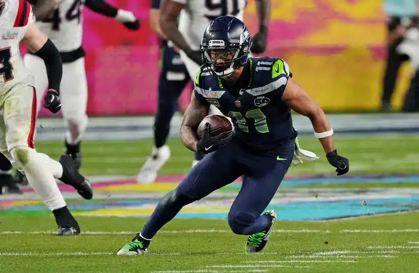 Seattle Seahawks wide receiver Jaxon Smith-Njigba (11) runs the ball during the third quarter against the New England Patriots in Super Bowl LX