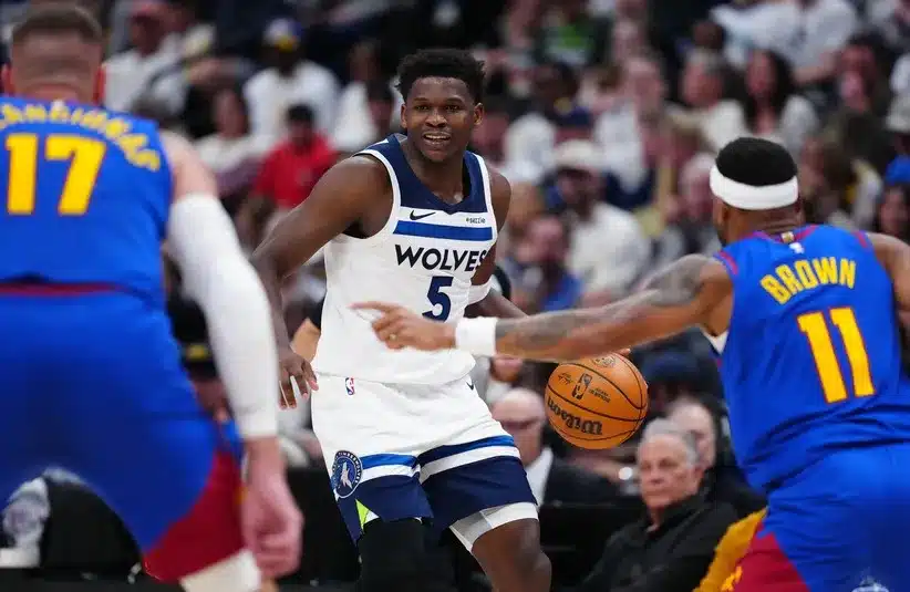 Minnesota Timberwolves guard Anthony Edwards (5) controls the ball vs Nuggets