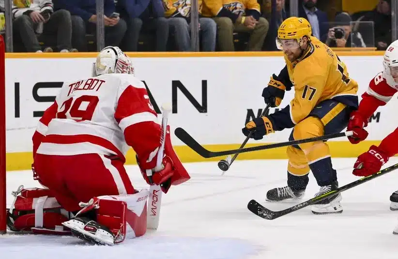 Detroit Red Wings goaltender Cam Talbot (39) blocks the shot of Nashville Predators center Tyson Jost (17)