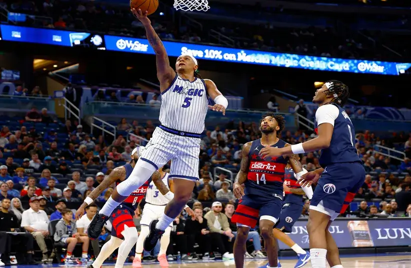 Orlando Magic forward Paolo Banchero (5) drives to the basket for a layup in the second half against the Washington Wizards.