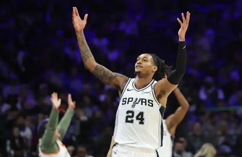 San Antonio Spurs guard Devin Vassell (24) reacts to his three pointer