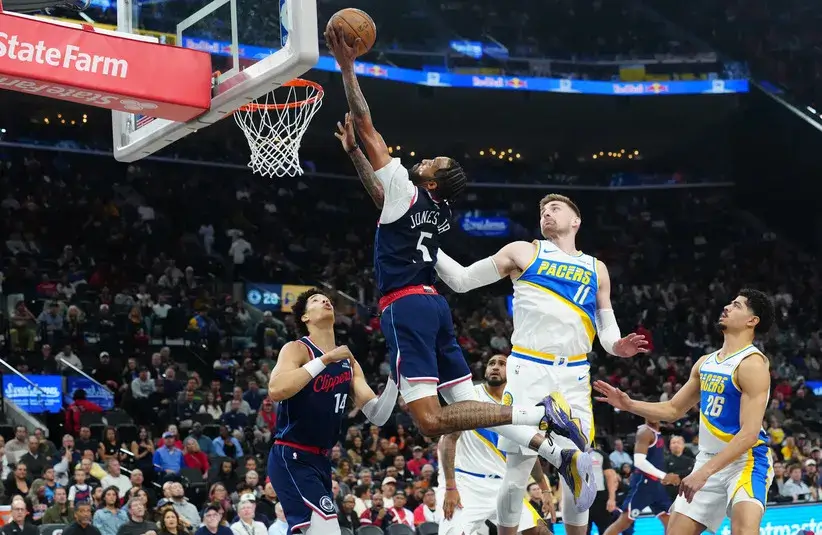 LA Clippers forward Derrick Jones Jr. (5) shoots the ball against Indiana Pacers center Micah Potter (11) in the first half.