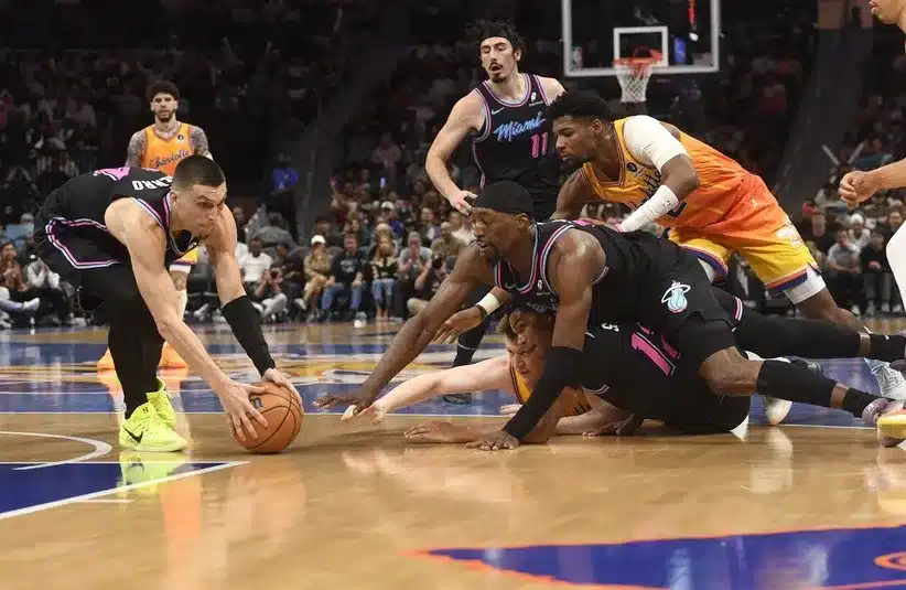 Miami Heat guard Tyler Herro (14) gets a loose ball