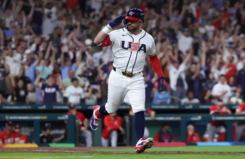 United States designated hitter Kyle Schwarber (12) rounds the bases