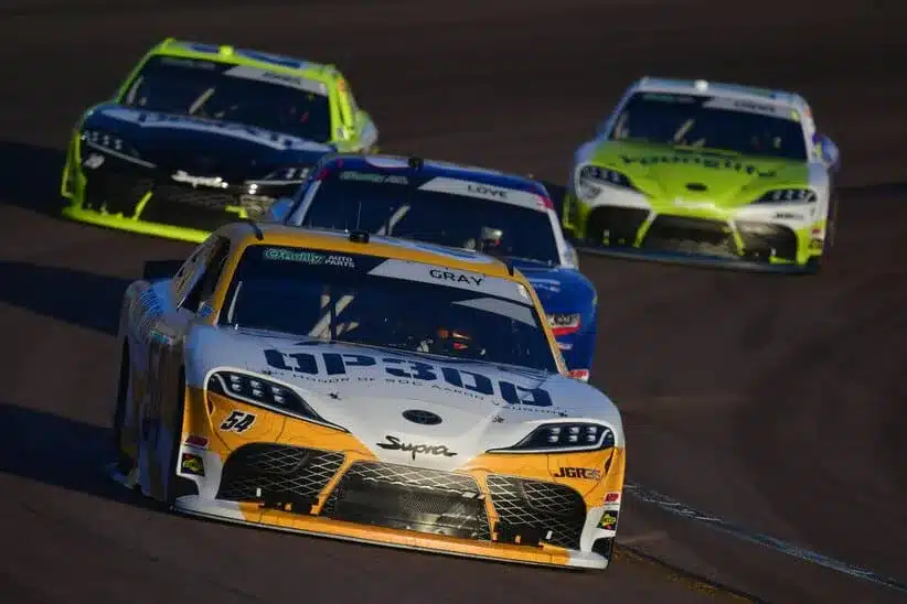 Mar 7, 2026; Avondale, Arizona, USA; Joe Gibbs Racing driver Taylor Gray (54) leads a group during the GOVX 200 at Phoenix Raceway.