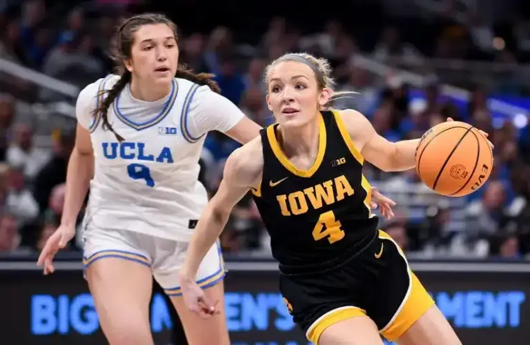 Iowa Hawkeyes guard Kylie Feuerbach (4) goes to the basket