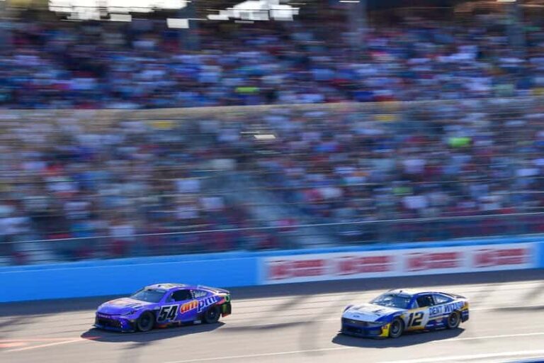 Mar 8, 2026; Avondale, Arizona, USA; Joe Gibbs Racing driver Ty Gibbs (54) leads Team Penske driver Ryan Blaney (12) during the Straight Talk Wireless 500 at Phoenix Raceway. Mandatory Credit: Gary A. Vasquez-Imagn Images