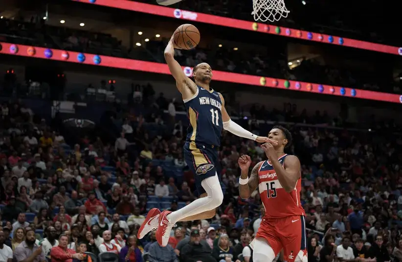 New Orleans Pelicans guard Bryce McGowens (11) dunks against Washington Wizards forward Julian Reese (15) during the second half.