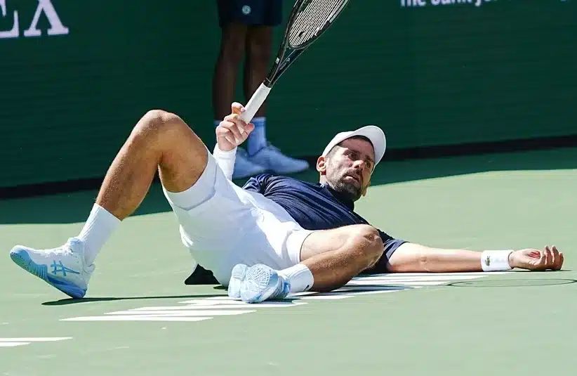 Djokovic falls on the court