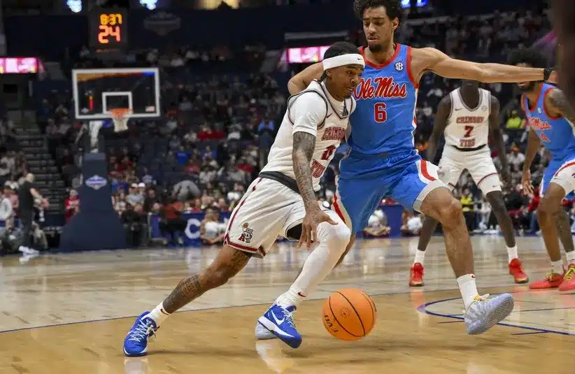 Alabama Crimson Tide guard Labaron Philon (0) dribbles the ball past Ole Miss Guard Ilias Kamardine (6)