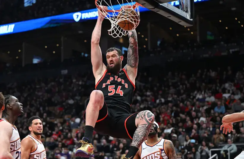 Toronto Raptors center Sandro Mamukelashvili (54) dunks the ball for a basket against the Phoenix Suns in the second half.