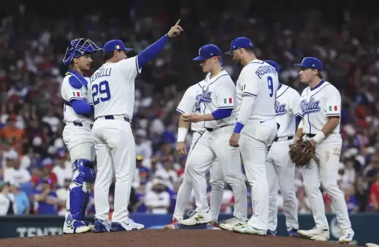 Italy manager Francisco Cervelli (29) calls to the bullpen