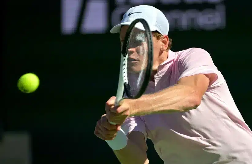 Jannik Sinner (ITA) hits a shot