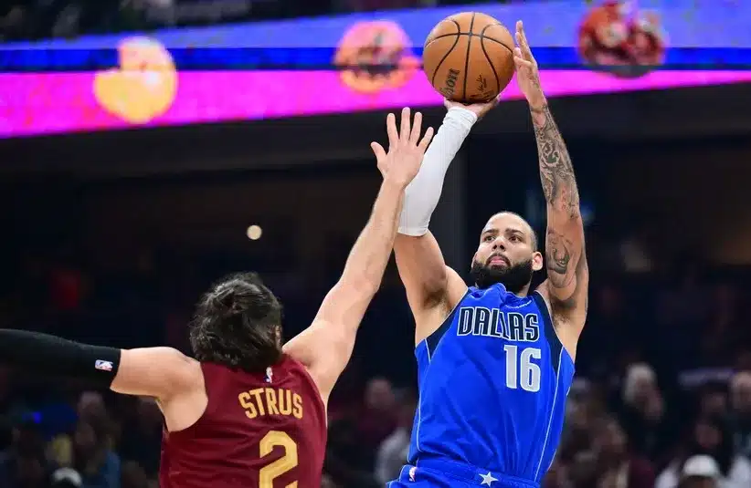 Dallas Mavericks forward Caleb Martin (16) shoots over the defense