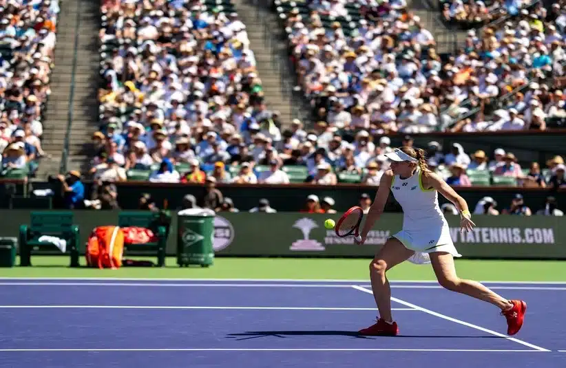 Rybakina hitting a backhand