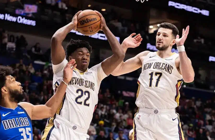 New Orleans Pelicans center Derik Queen (22) grabs a rebound