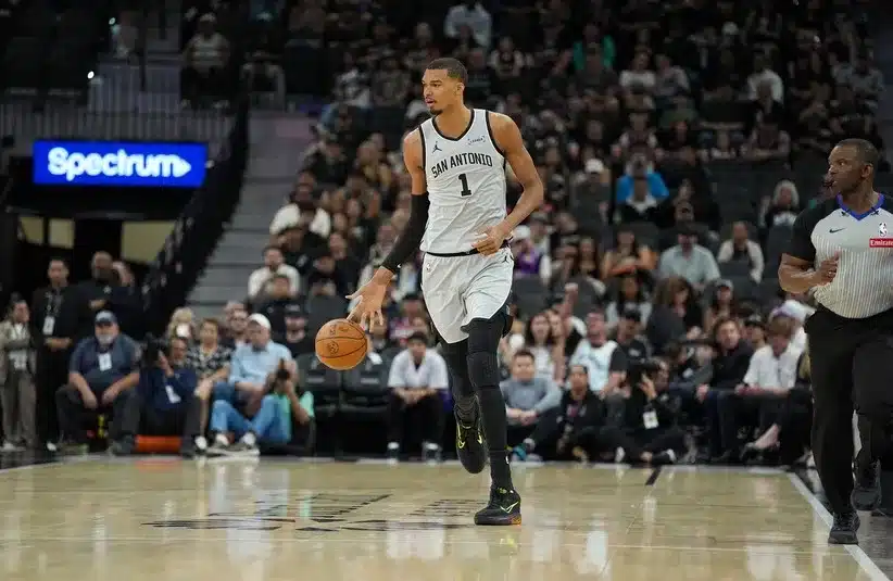 San Antonio Spurs forward Victor Wembanyama (1) dribbles up the court