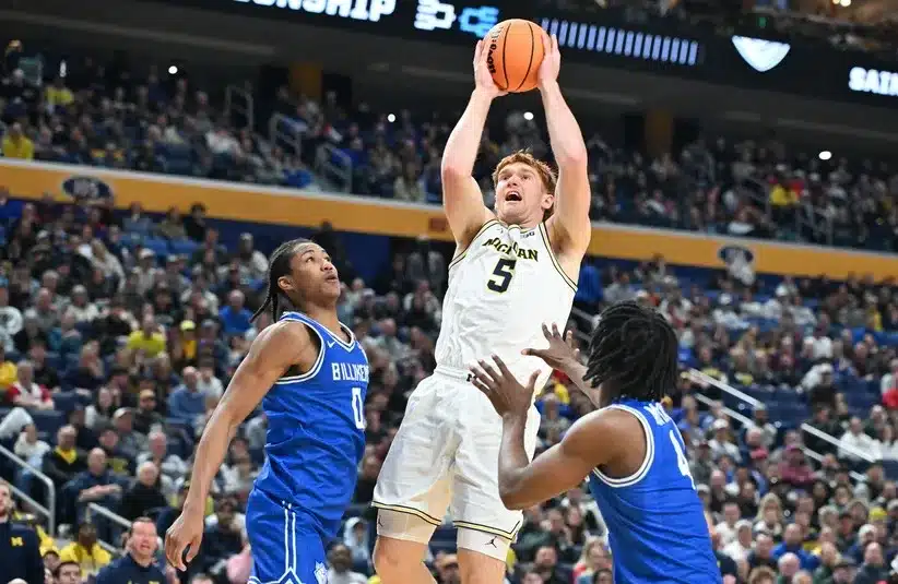 Michigan Wolverines forward Oscar Goodman (5) shoots the ball