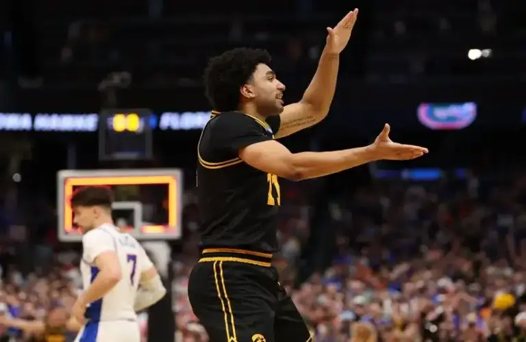 Iowa Hawkeyes guard Kael Combs (11) celebrates after defeating the Florida Gators