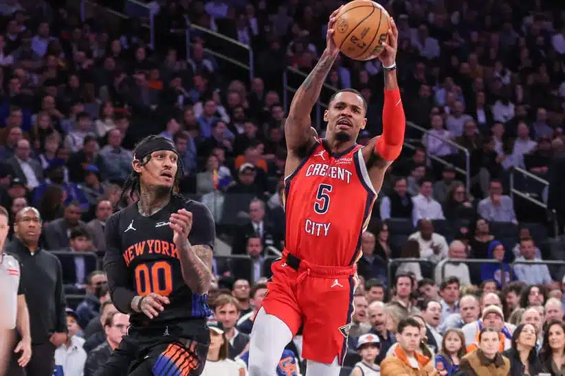Mar 24, 2026; New York, New York, USA; New Orleans Pelicans guard Dejounte Murray (5) drives past New York Knicks guard Jordan Clarkson (00) in the third quarter at Madison Square Garden.