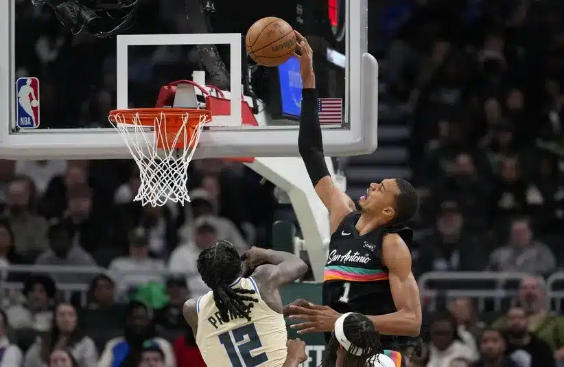 San Antonio Spurs forward Victor Wembanyama (1) shoots over Milwaukee Bucks forward Taurean Prince (12).
