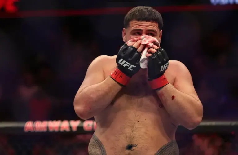 Tai Tuivasa (red gloves) after the fight against Sergei Pavlovich (blue gloves).