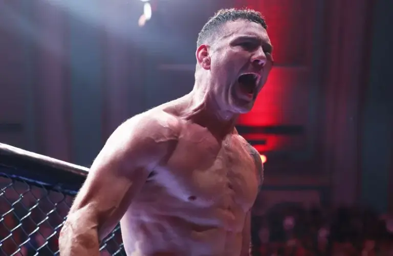 Chris Weidman (red gloves) celebrates after defeating Bruno Silva.