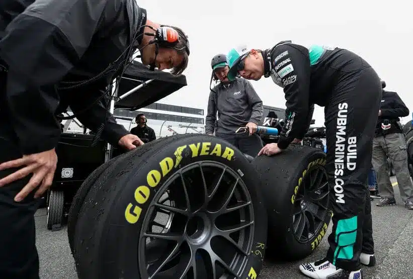 Apr 27, 2024; Dover, Delaware, USA; NASCAR Cup Series driver Brad Keselowski along with a few members of his crew look at the Goodyear Eagles racing tires during practice and qualifying for the Wurth 400 at Dover Motor Speedway.