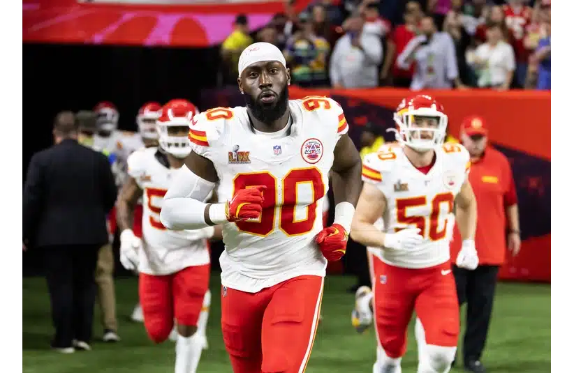 Charles Omenihu running onto the field before Super Bowl LIX