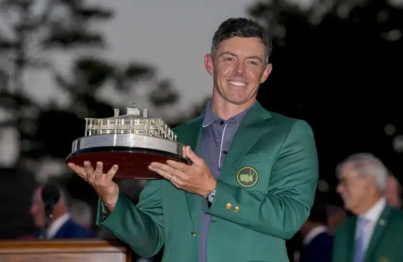 Rory McIlroy holds the Masters championship trophy.
