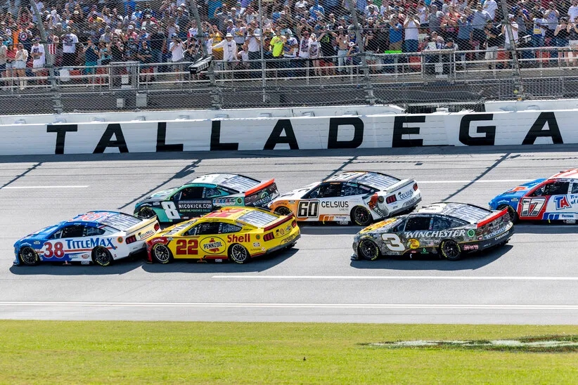 Apr 27, 2025; Talladega, Alabama, USA; NASCAR Cup Series drivers Zane Smith (38) and Kyle Busch (8) battle for an early lead during stage one of the NASCAR: Jack Link's 500 at Talladega Superspeedway.