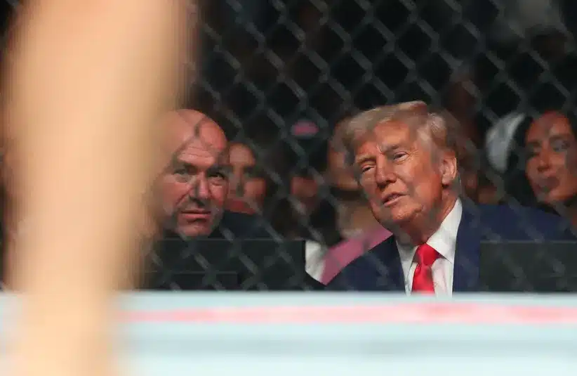 CEO of UFC Dana White talks with the President of the United States Donald Trump during UFC 316 at Prudential Center.