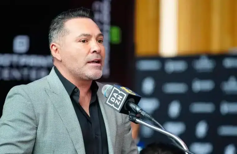 Oscar De La Hoya speaks about boxer Jamie Munguia (center) about the Munguia v Ryder main event during a press conference.