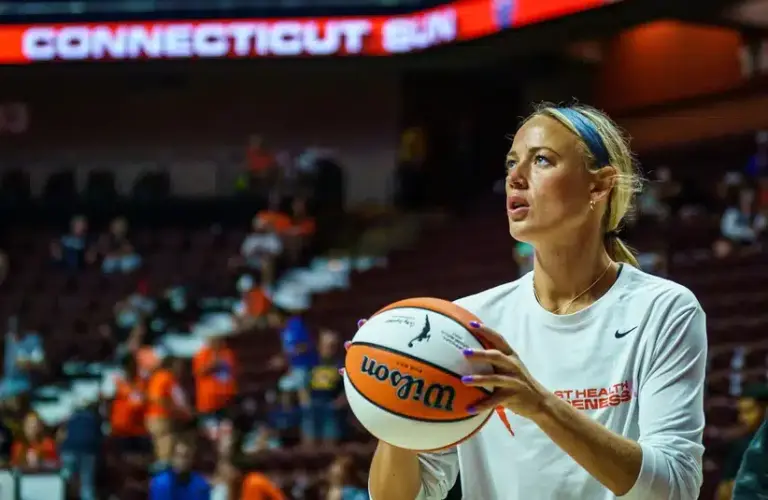 Sophie Cunningham waring up during a Fever game last season.