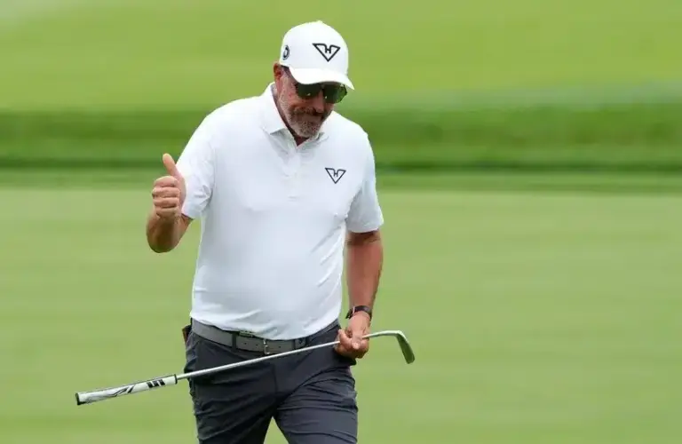 Phil Mickelson of Team HyFlyers GC reacts to the cheers of his fans as he walks up to the fourth green.