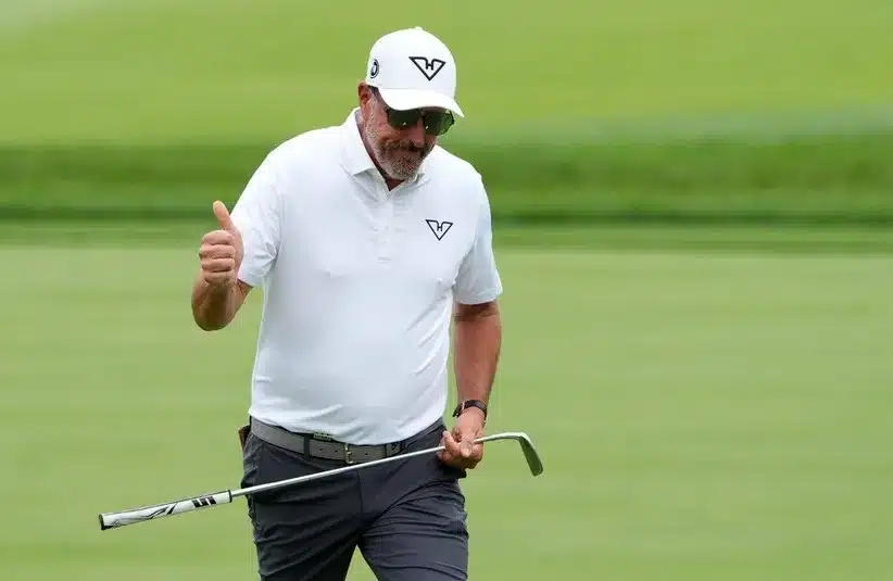Phil Mickelson of Team HyFlyers GC reacts to the cheers of his fans as he walks up to the fourth green.