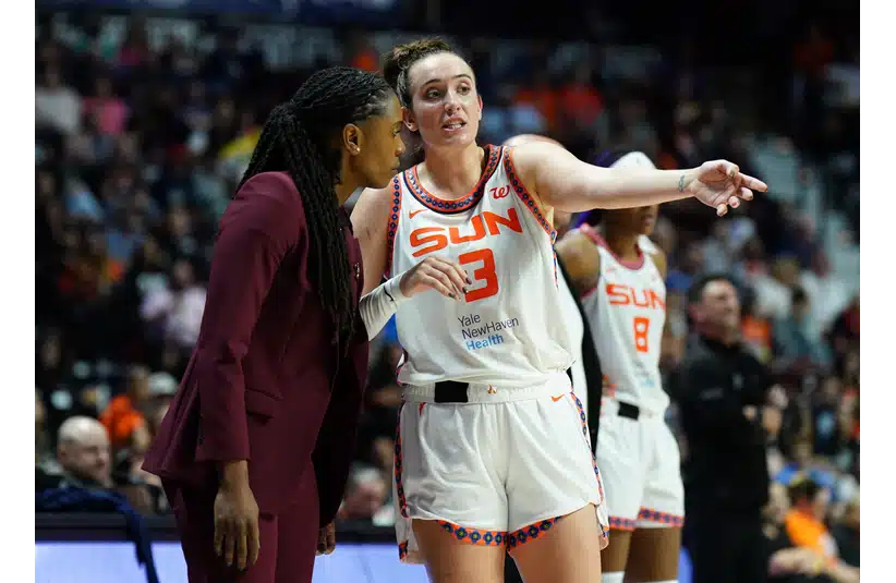 Marina Mabrey talking with one of her coaches during a game last season.