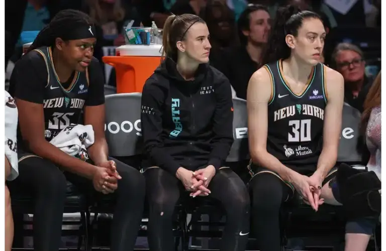 The New York Liberty Big 3 looking on the action from the bench