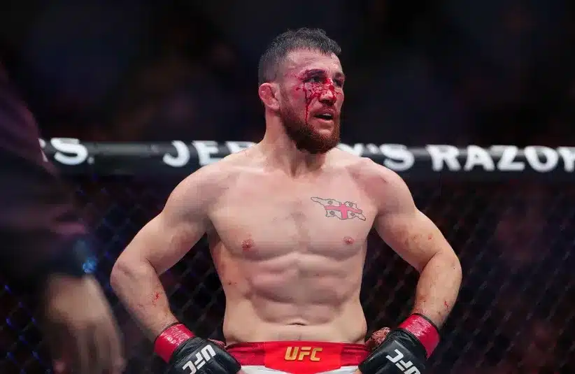 Merab Dvalishvili (red gloves) during the fight against Petr Yan.