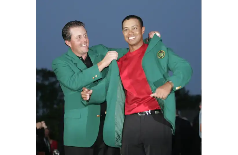 Tiger Woods receiving his 2005 Green Jacket from Phil Mickelson