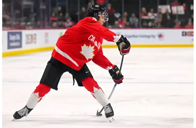 Gavin McKenna shooting the puck