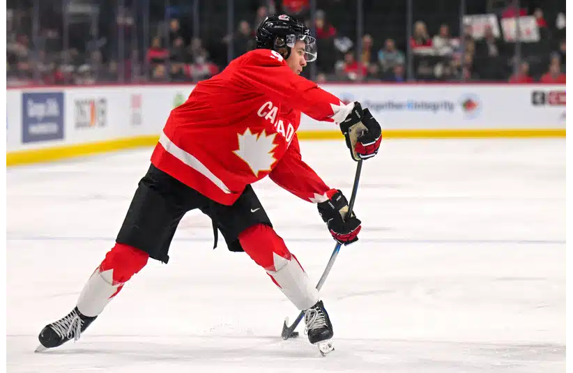 Gavin McKenna shooting the puck