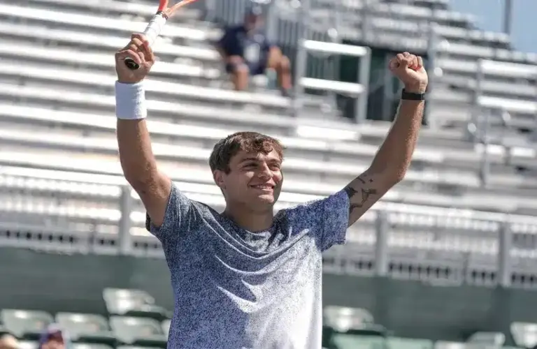 Flavio Cobolli celebrates winning the mixed doubles finals.