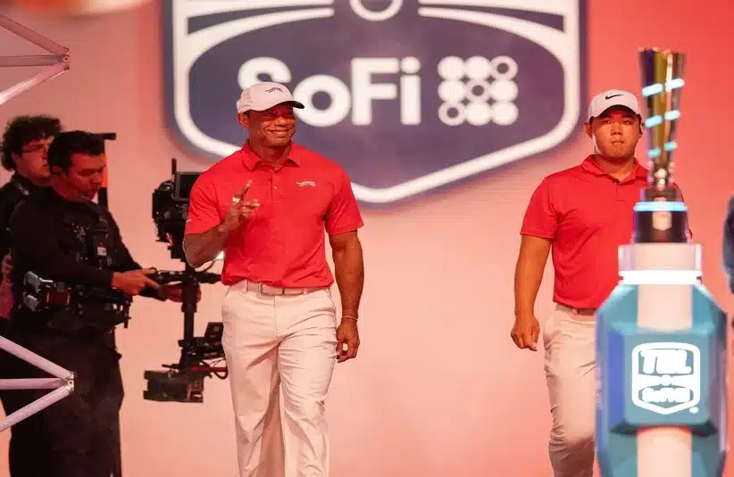 Tiger Woods alongside his team staff
