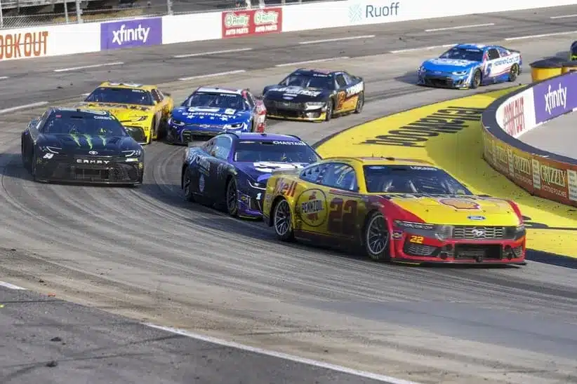 Cup Series; Mar 29, 2026; Martinsville, Virginia, USA; Team Penske driver Joey Logano (22) passes driver Ross Chastain (1) out of turn four at Martinsville Speedway.
